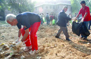 Students of St. Stephens and Hindu colleges take part in a cleanliness drive organised by the two colleges on the Delhi University campus in New Delhi
