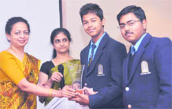 Students of Scholars Home with the trophy of the quiz competition at the Naval Hydrographic Office in Dehradun on Thursday.