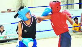 A bout in the district-level boxing championship in Dehradun on Thursday.