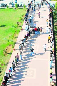 Students of the NSS wing of Guru Jambheshwar University of Science and Technology, Hisar, form a human chain on the campus to mark the World AIDS Day