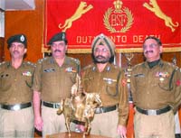 Himmat Singh, Inspector General of Punjab Frontier, BSF, poses with the Maharana Pratap Trophy for the best border management in Jalandhar on Thursday. 