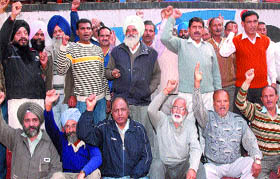 BSNL employees stage a demonstration against disinvestment in Jalandhar on Thursday.