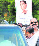 Chief Minister N Kiran Kumar Reddy (inside car) interacts with APCC chief D Srinivas after a function in Hyderabad on Thursday.