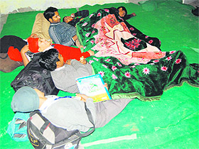 Children who had come to participate in the state science exhibition sleep on the floor in Amritsar on Thursday
