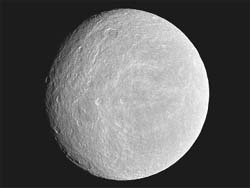 NASAs Cassini spacecraft imaged the cratered plains of the trailing hemisphere of Rhea, one of planet Saturns moons, in this photograph released by NASA November 29, 2010. Some of the moons fractures, appearing like wispy bright lines, can be seen on the left of the image. The moon is 1,528 kilometres across. 