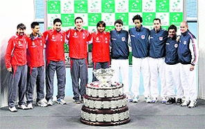 Members of Serbian and French tennis teams pose with the Davis Cup trophy after the official draw at Belgrade Arena on Thursday. Serbia and France will play their Davis Cup final match from December 3-5 in Belgrade.  Reuters
