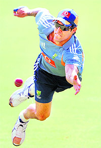 Australian paceman Mitchell Johnson dives for a ball during training for the second Ashes cricket Test match in Adelaide on Thursday Johnson is struggling for form taking 0-170 in the first Test and has been dropped.