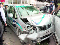 The mangled remains of a demo Maruti Suzuki SX4 car after it hit cars parked outside an automobile showroom in Industrial Area, Phase I; people lift a damaged Alto car to pull out 10-year-old schoolboy Suraj, who was trapped following the accident; and the injured boy being taken to the hospital in Chandigarh on Friday