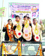 Members of the Asiad gold-winning Indian Kabaddi team, Samarjit and Kaptan Singh, being honoured in Bhiwani on Thursday.