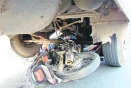 MANGLED REMAINS: A motorcyclist had a narrow escape after a bus hit his vehicle in Jammu on Friday.