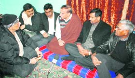 Members of a parliamentary and civil society team on Friday meet a member of the family of Tufail Mattoo in Srinagar. The youth was killed allegedly by the security forces on June 11.