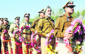 Police officers queue up to lay wreaths on the memorial of police personnel who lost their lives while tackling militancy during the Police Commemoration Day at Zewan in Srinagar.