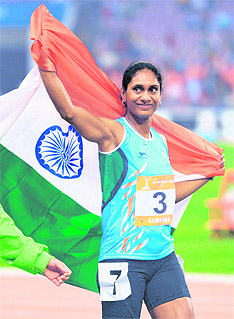 Pramila Gudandda celebrates after she won the bronze medal in women’s heptathlon Photos: AFP, PTI