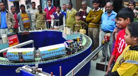 Visitors witness the demo of a toy train during Rail Fair organised by Womens Northern Railway Organisation at Baroda House in New Delhi