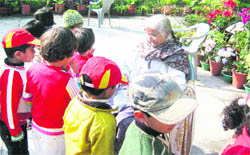 Eurokids students interact with an elderly at Prem Dham in Dehradun on Friday.