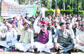 Congress workers hold protest at the Gandhi Park, Dehradun, on Saturday. 