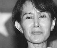 Myanmars pro-democracy leader Aung San Suu Kyi speaks at the National League for Democracy (NLD) party headquarters during the countrys 90th National Day in Yangon. 