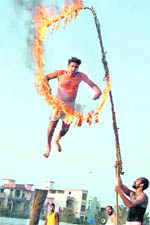 An acrobat displays his skills during the Virasat Mela in Jaipalgarh village in Bathinda on Saturday