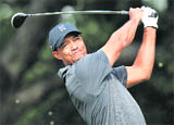 Tiger Woods tees off on the fourth hole during the second round of the Chevron World Challenge golf tournament at Sherwood Country Club on Saturday.