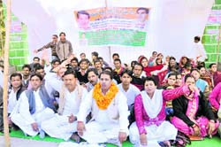 Members of the Rajiv Gandhi Sena protest against the state government in Dehradun on Saturday. 