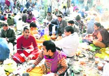 People perform rituals on occasion of Amawasya at the Shri Narayani Shilla Temple at Devpura, Haridwar, on Sunday.
