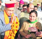 Residents welcome Chief Minister PK Dhumal in Dharamsala on Sunday. 