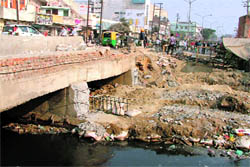 The damaged bridge near Shingaar Cinema due to the ongoing road-widening project