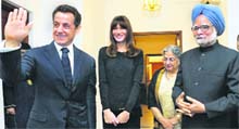 Prime Minister Manmohan Singh and his wife Gursharan Kaur with French President Nicholas Sarkozy and his wife Carla Bruni at their residence in New Delhi.