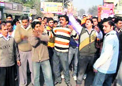 The residents protest against the failure of the police to arrest the assailants of municipal councillor Kulwant Singh Maggo in Ferozepur on Sunday