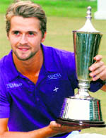 Swedens Rikard Karlberg with the trophy after winning the Hero Honda Indian Open in New Delhi on Sunday