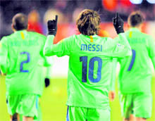 Lionel Messi celebrates after scoring his teams second goal during their match against CA Osasuna at Reyno de Navarra stadium in Pamplona on Saturday
