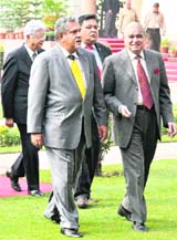 Industrialists Vijay Mallya, Azim Premji and Dhruv Sahani arrive to attend a joint press conference of Prime Minister Manmohan Singh and France President Nicholas Sarkozy in New Delhi on Monday. 