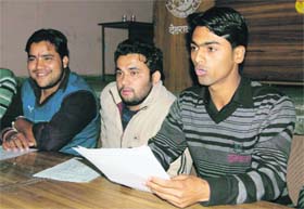 Anshul Chawla, president of the DAV PG College Students Council (right), addresses a press conference in Dehradun