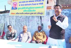 Congress leader Suryakant Dhasmana addresses a commemoration function of Dr BR Ambedkar at Ravidas Dharamshala in Dehradun