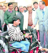 A differently abled person, who was given a tricycle at a function in Sirsa, on Monday.