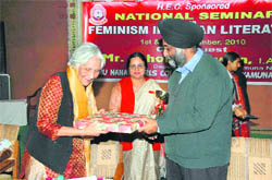MS Sawhney, general secretary of the Guru Nanak Girls College Management Committee, honours chief guest Dr Jasbir Jain as Dr Varinder Gandhi, principal (centre) looks on.
