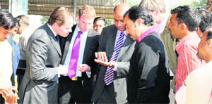 lansdowns delegates examine paddy at the New Grain Market in Rewari. 