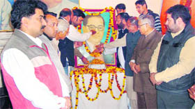 Members of the Anusuchit Jaati Morcha pay homage to Dr B.R. Ambedkar on his 54th death anniversary in Jammu on Monday.