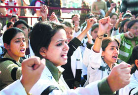 Members of the Jammu and Kashmir Physiotherapists Association hold a demonstration in Jammu on Monday.