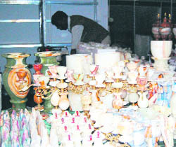 A Pakistani shopkeeper arranges goods at his stall during the PITEX 2010 organised by PhD Chamber in Amritsar on Tuesday.