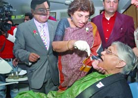 Chief Minister Sheila Dikshit being examined by Health Minister Kiran Walia while Dr Mahesh Verma, principal, Maulana Azad Medical College, looks on during the inauguration of Dental Health Utsav-2010 Delhi Smiles at Maulana Azad Institute of Dental Sciences in New Delhi