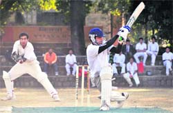 A batsman misses a shot in the Senior Council Cricket Tournament in Dehradun on Tuesday. 