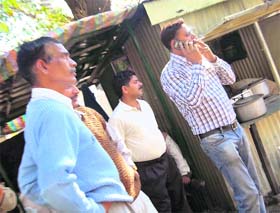 A man smokes in front of a police station at Dharamsala, not caring two hoots for the ban on smoking in public places.