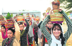 Women take part in a religious procession at Asa Ram Bapu Ashram, Bhagwati Nagar, in Jammu.