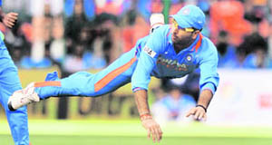 Yuvraj Singh jumps in the air after throwing the ball during the fourth ODI against New Zealand in Bangalore on Tuesday.