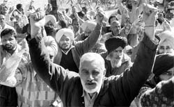 Powercom employees stage a protest in support of their demands in Mohali