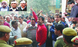 Residents of Laxmi Nagar shout slogans against the MCD when the corporation officials were engaged in a sealing campaign. Some people were injured (inset) in the drive in New Delhi