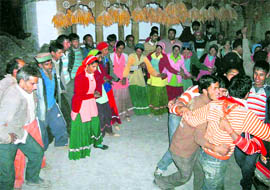 Villagers dance on the occasion of Divali in Bhatoli village