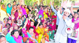 Women from lower strata hold a protest at Devpura in Haridwar on Wednesday.