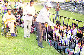 Supporters of Keepa collect donations for his treatment during a sports tournament at Mehma Singh Wala.